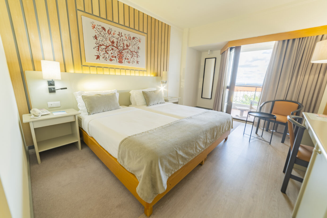 A comfortable and spacious room with either two single beds or a double bed, a lounge area and a furnished balcony overlooking the city. Area: Approx 20 m²