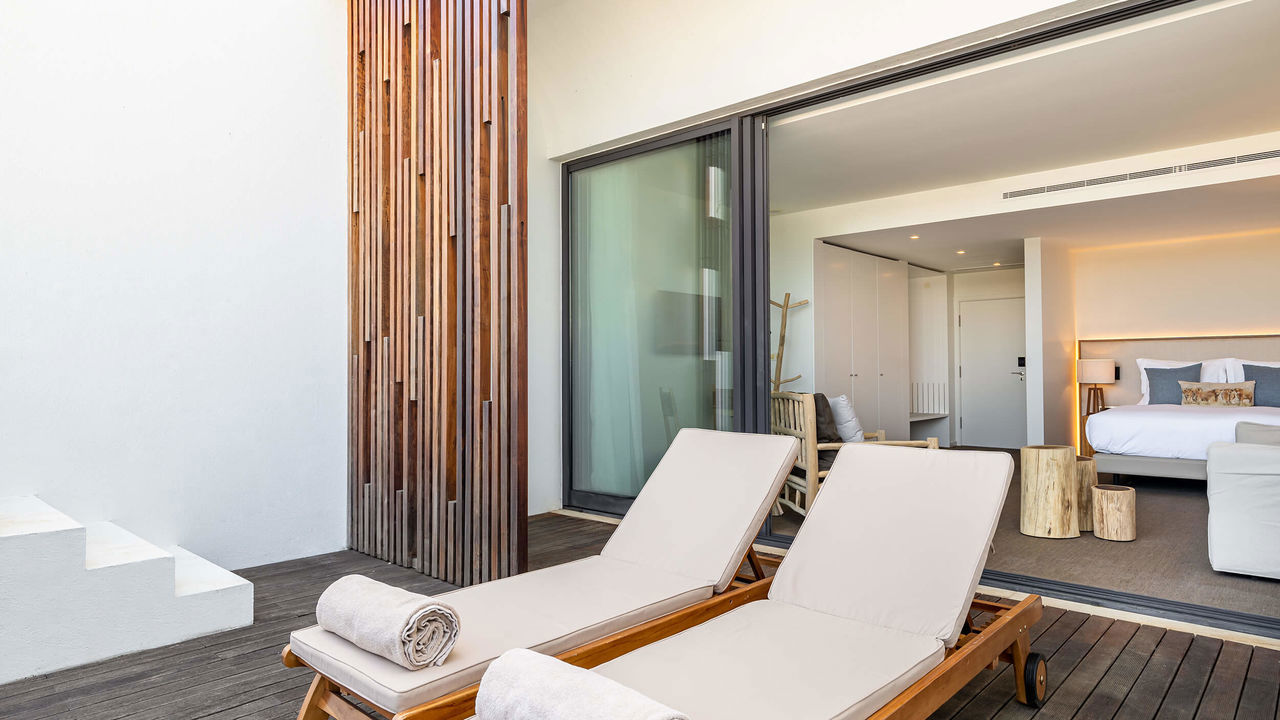 This room features a double bed with a sofa bed and a terrace with direct access to the pool. Area of the room: 33 m2 + terrace 15 m2